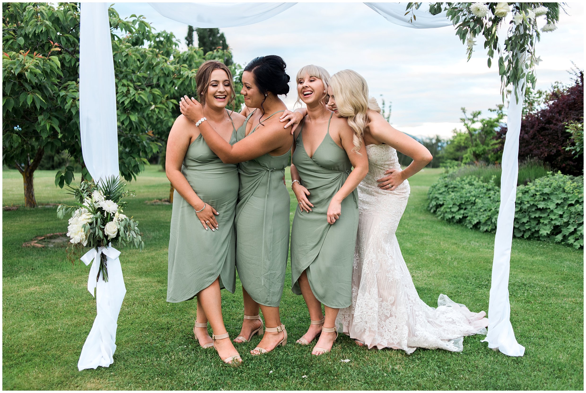 bridesmaids wanaka wedding sage green bride laughing candid sunset evening reception outside lawn lipsky sons