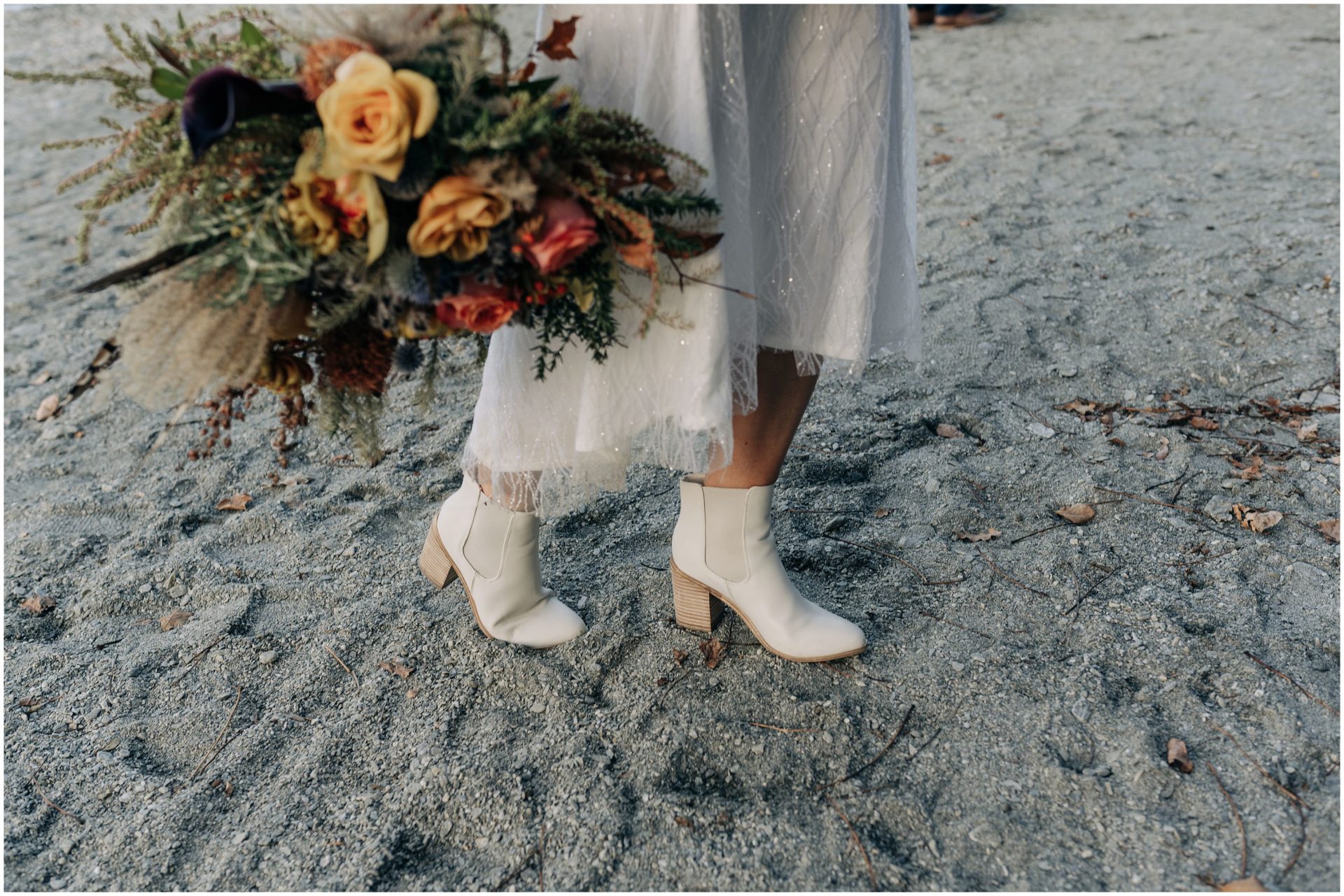 wedding dress wanaka new zealand photographer mountains winter bride boots white documentary candid