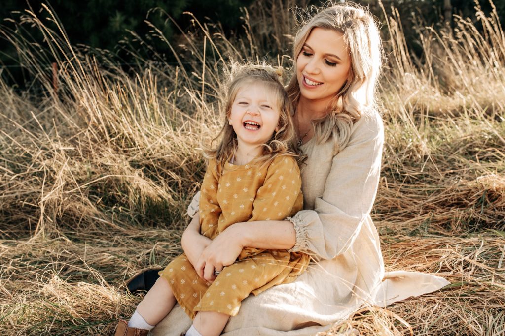sunset mum daughter christchurch family portraits update yellow dress natural palette ideas pose blonde cuddle candid