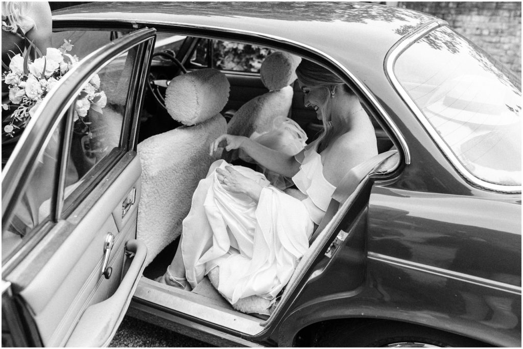 bride gets out of classic car trents vineyard wedding christchurch photographer elegant modern