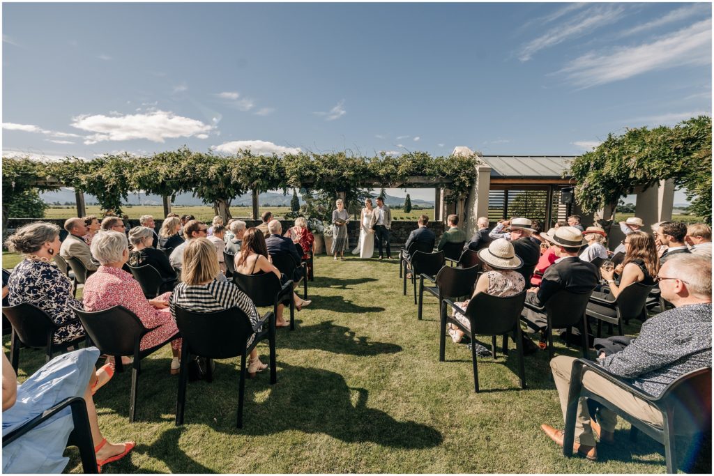 wedding ceremony on the lawn at wither hills vineyard venue in blenheim new zealand