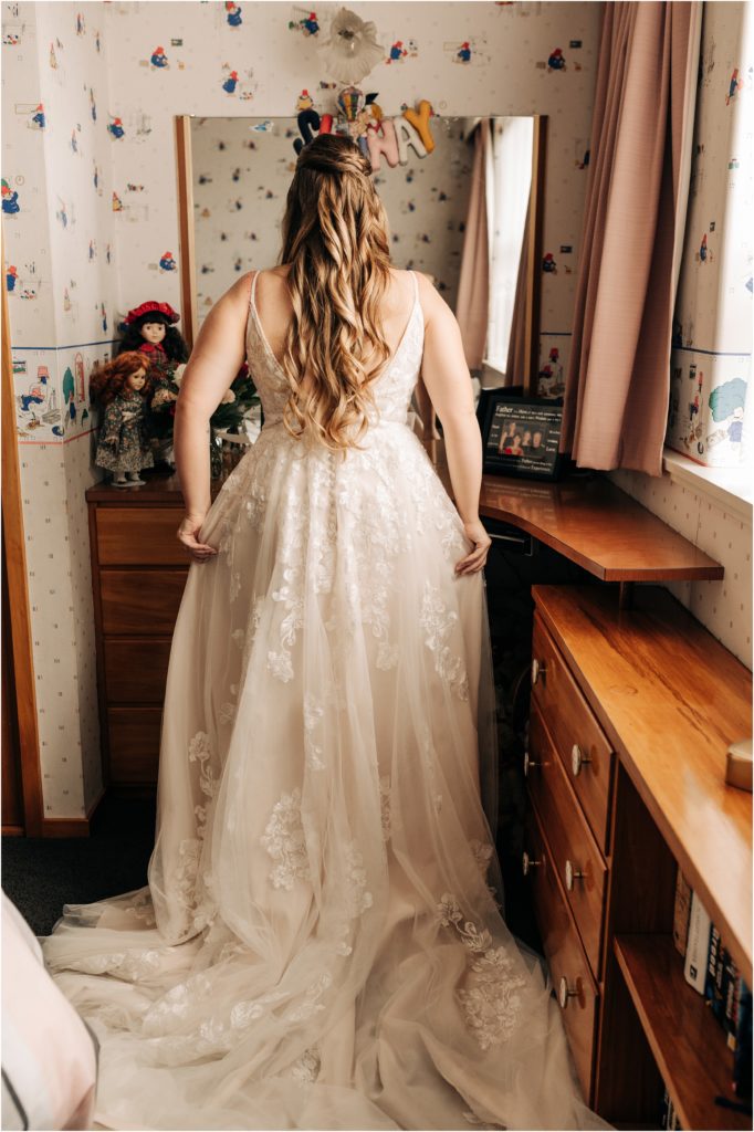 bride in childhood bedroom getting ready invercargill pink room long hair