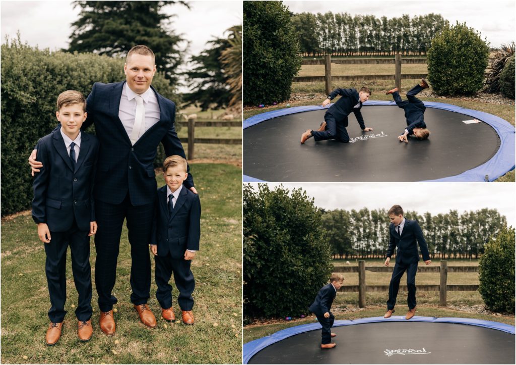 groom with sons matching suits wedding day jumping on trampoline christchurch nz photographer navy suits