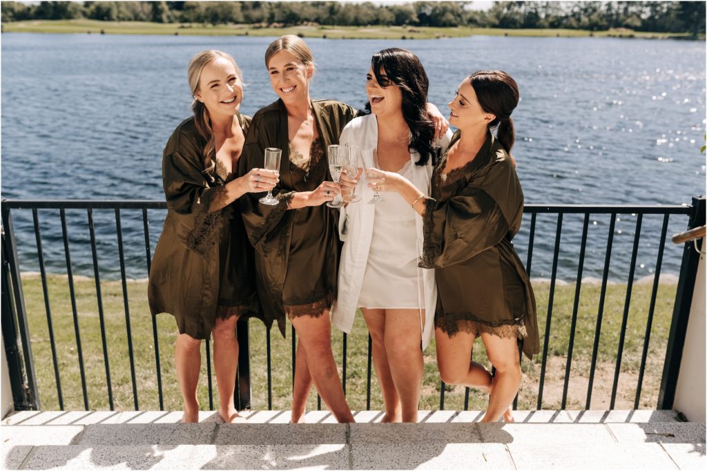 bride bridesmaids robes olive green clearwater christchurch wedding ellie haines loving ellies belly cheers champagne