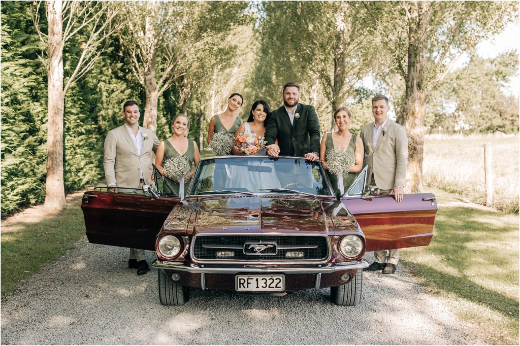 bridal party convertible car green dress olive linen ellie haines loving ellies belly wedding photographer christchurch 