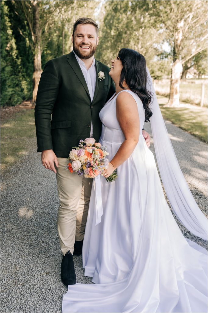ellie haines loving ellies belly wedding photographer christchurch  bride groom olive green linen white dress pastel bouquet 
